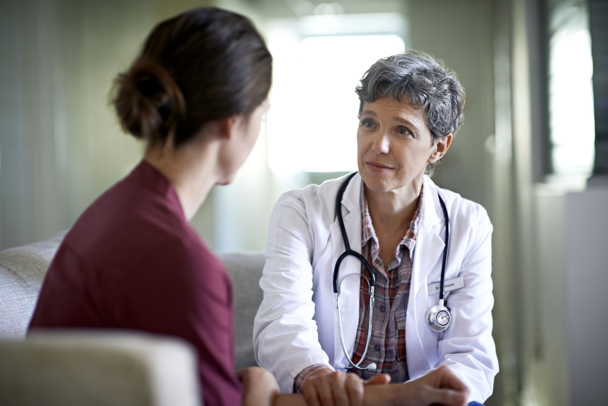 Female-Doctor-talking-with-Female-Patient