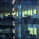 Workplaces-behind-clear-windows-in-financial-building_thumbnail